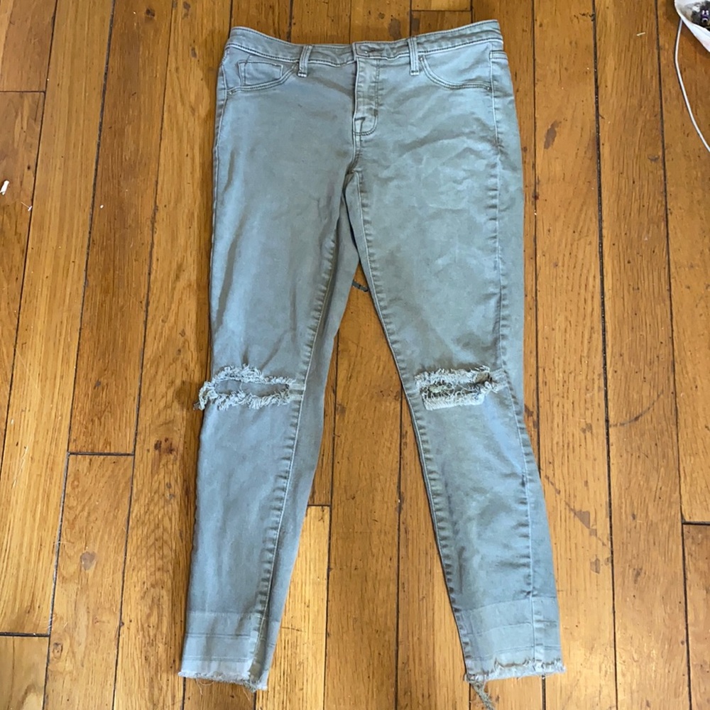 Army green jeggings with knee holes.